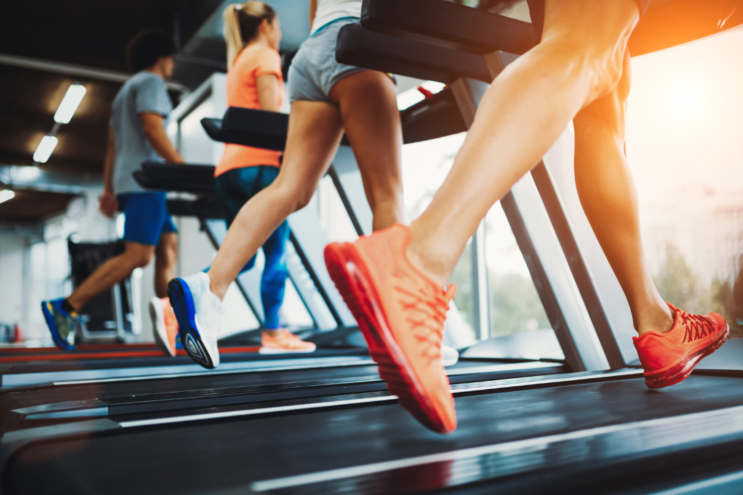 A close up people running on treadmills