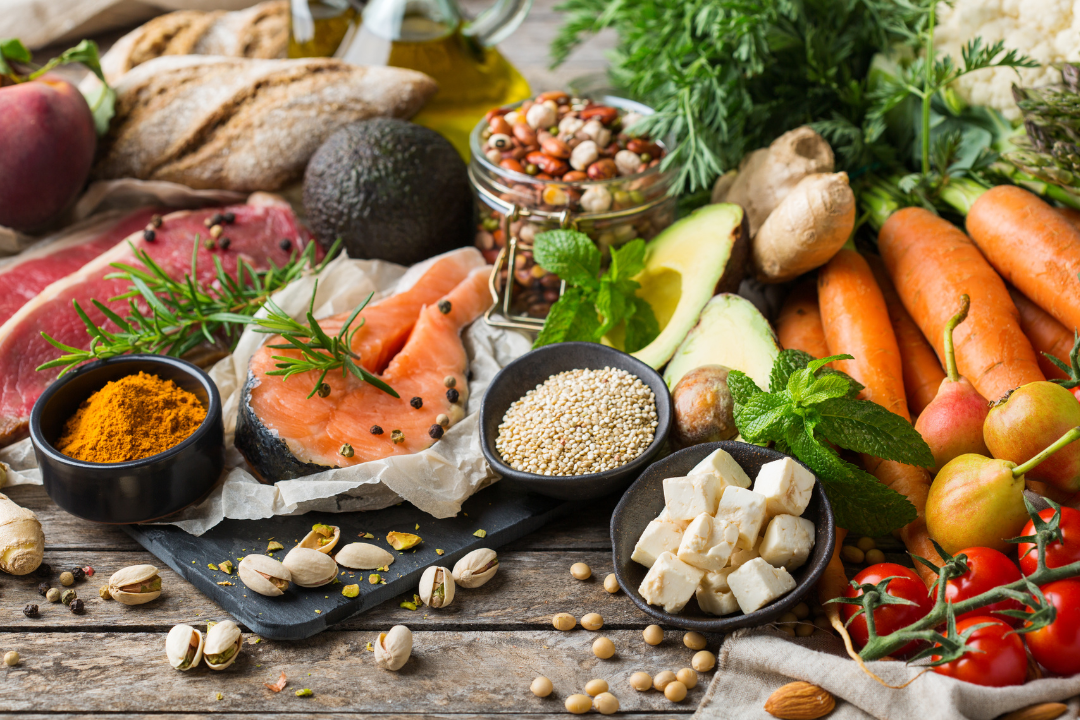 an array of healthy whole foods laid out on a table