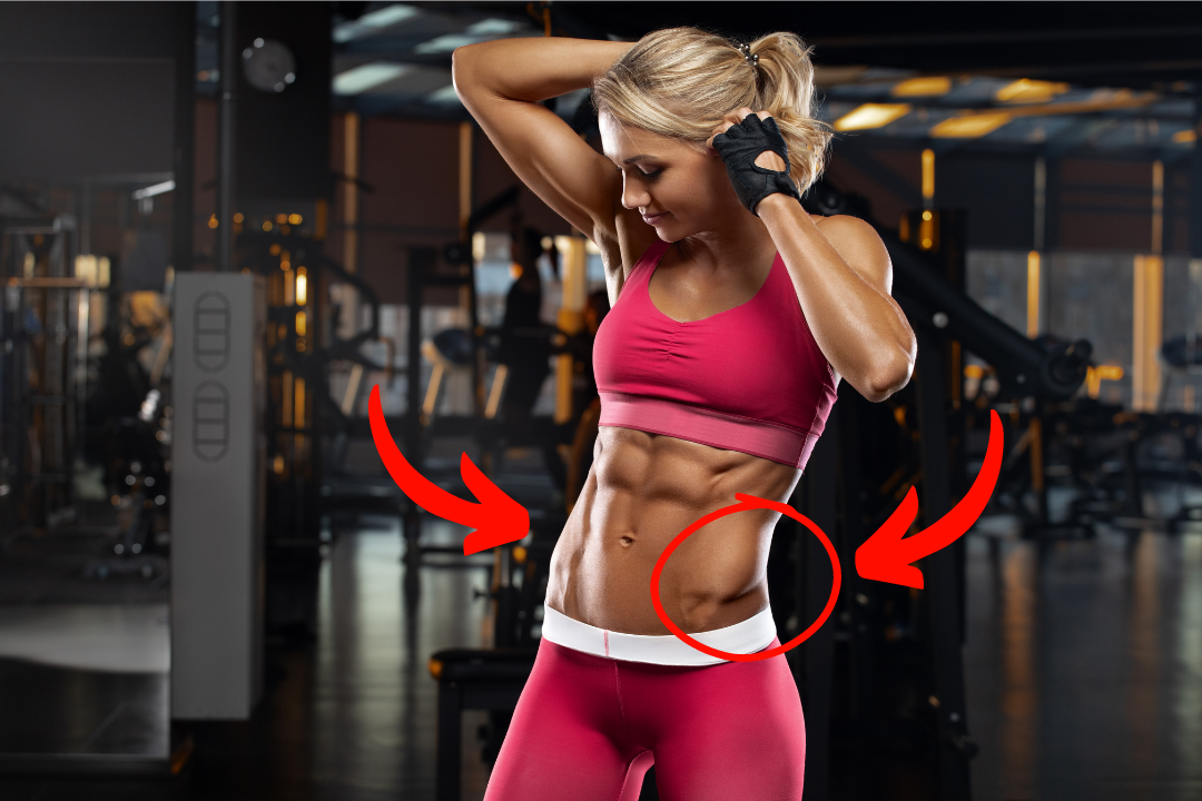 A close up of a woman in pink activewear showing her abdominal muscles